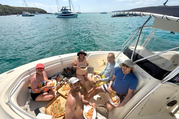 a group of people on a boat in the water