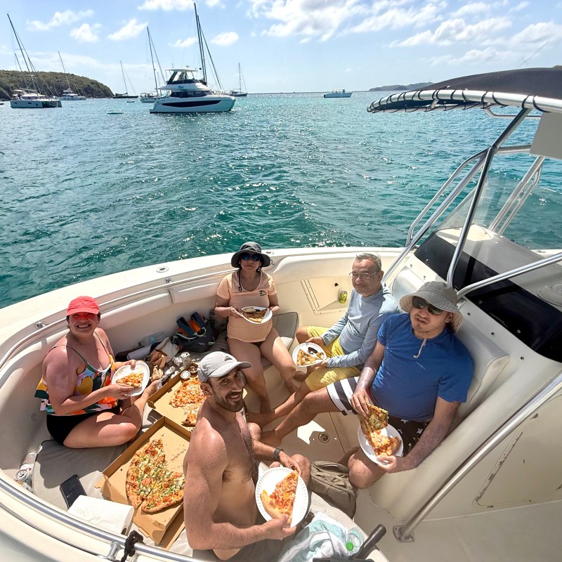 a group of people on a boat in the water