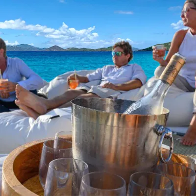 a group of people sitting at a beach
