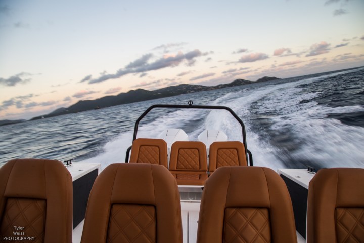a boat that is sitting on the side of a snow covered mountain