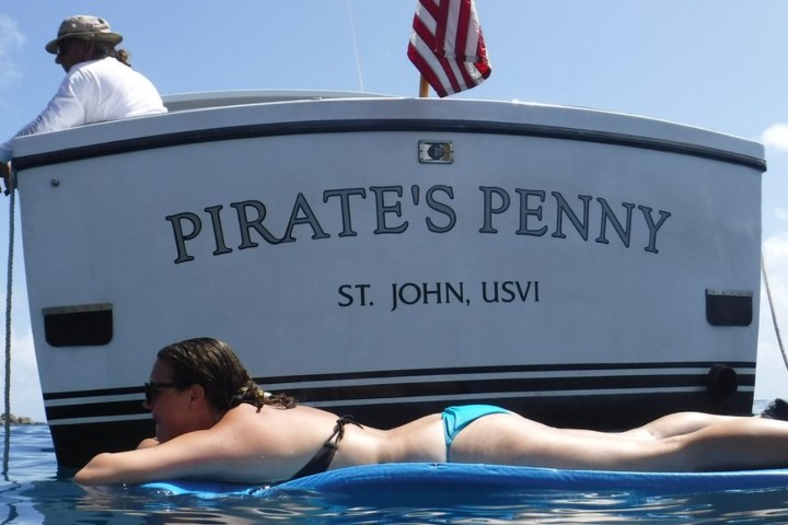 a person lying on a boat in the water