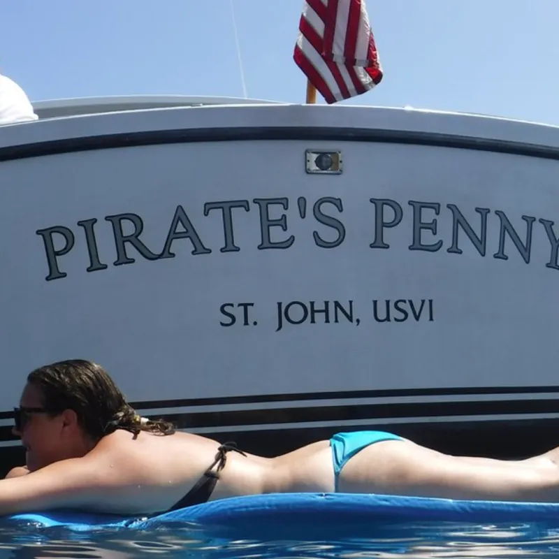 a person lying on a boat in the water