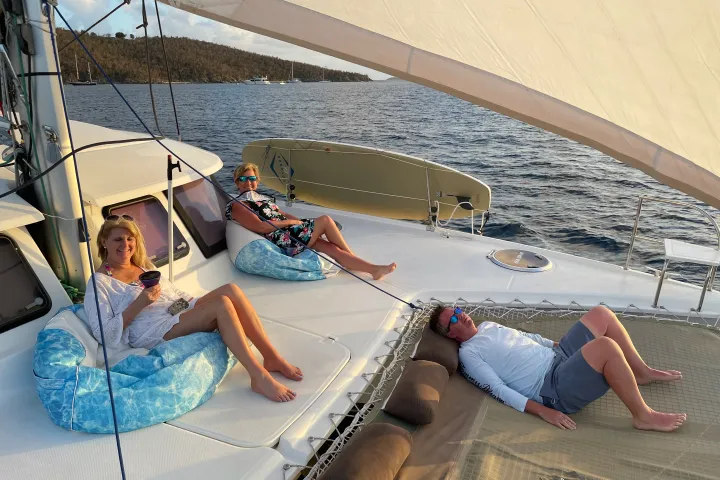 a group of people sitting at a beach