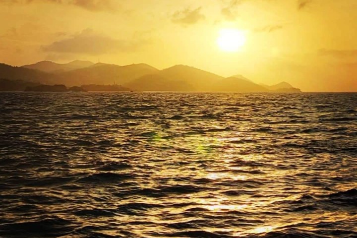 a sunset over a body of water