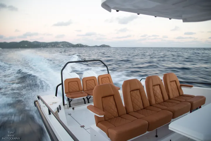 a chair next to a body of water