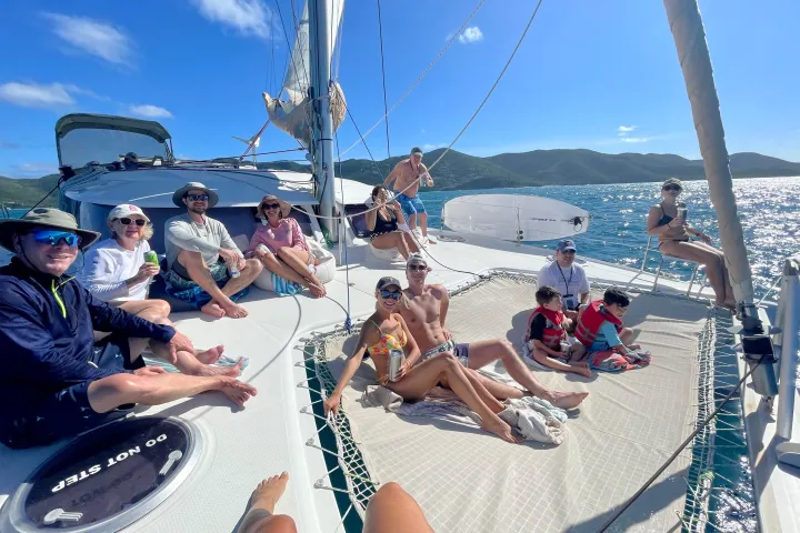 a group of people riding on the back of a boat