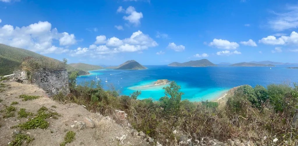 a body of water with a mountain in the background