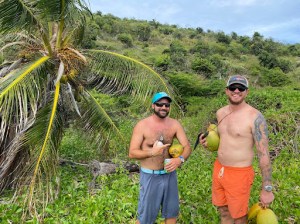 a man standing next to a tree