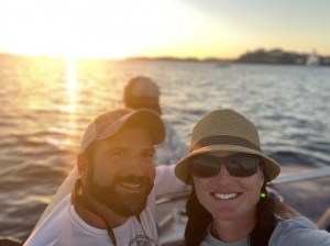 a person standing next to a body of water