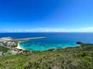 a view of a beach next to a body of water