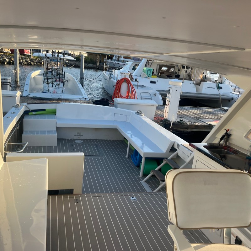 a group of people standing around a plane