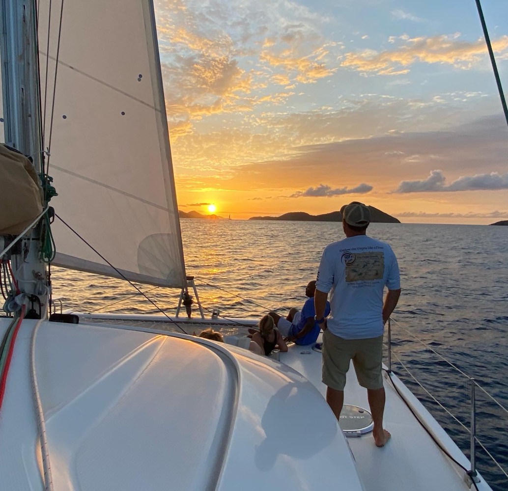 a person standing on a boat in the water