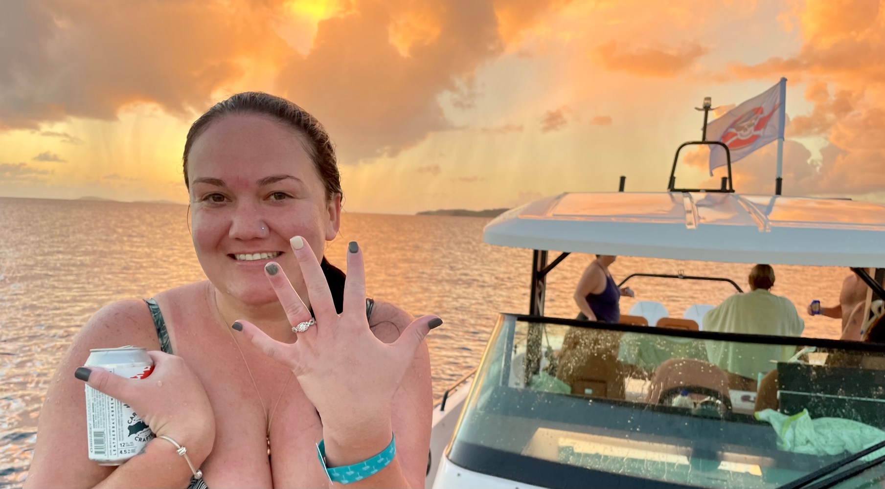 a man and a woman taking a selfie in front of water