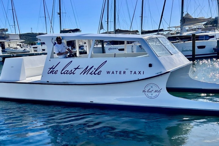 a boat is docked next to a body of water