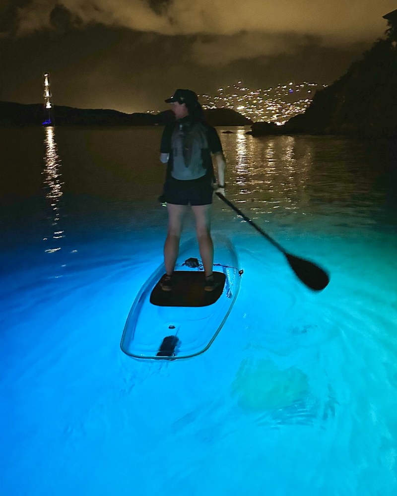 a person riding on the back of a boat in the water