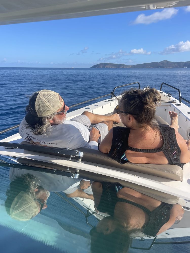 a group of people in a boat on a body of water