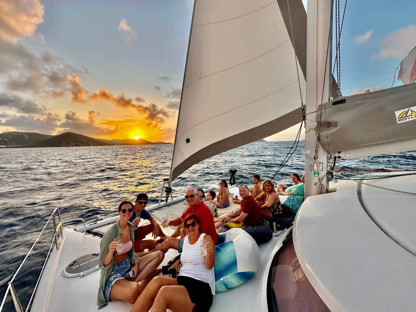 a group of people in a boat on a body of water