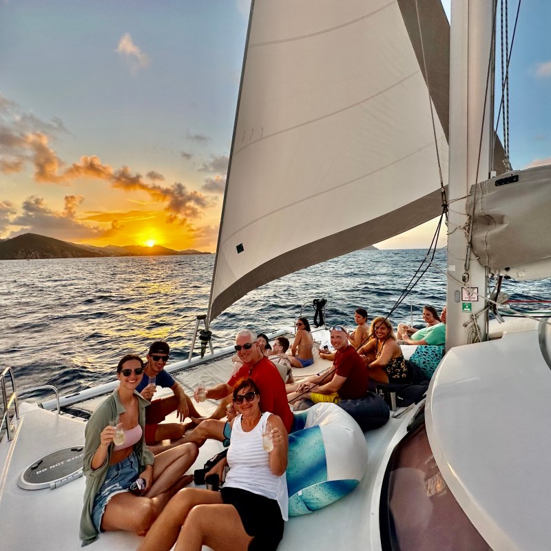 a group of people in a boat on a body of water