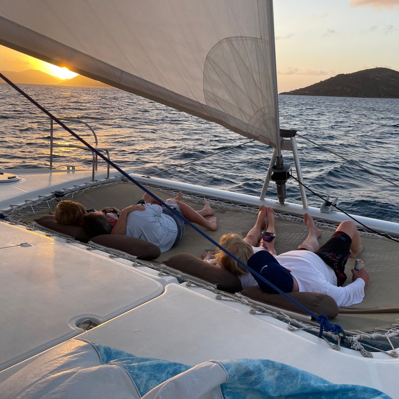 a group of people lying in a body of water