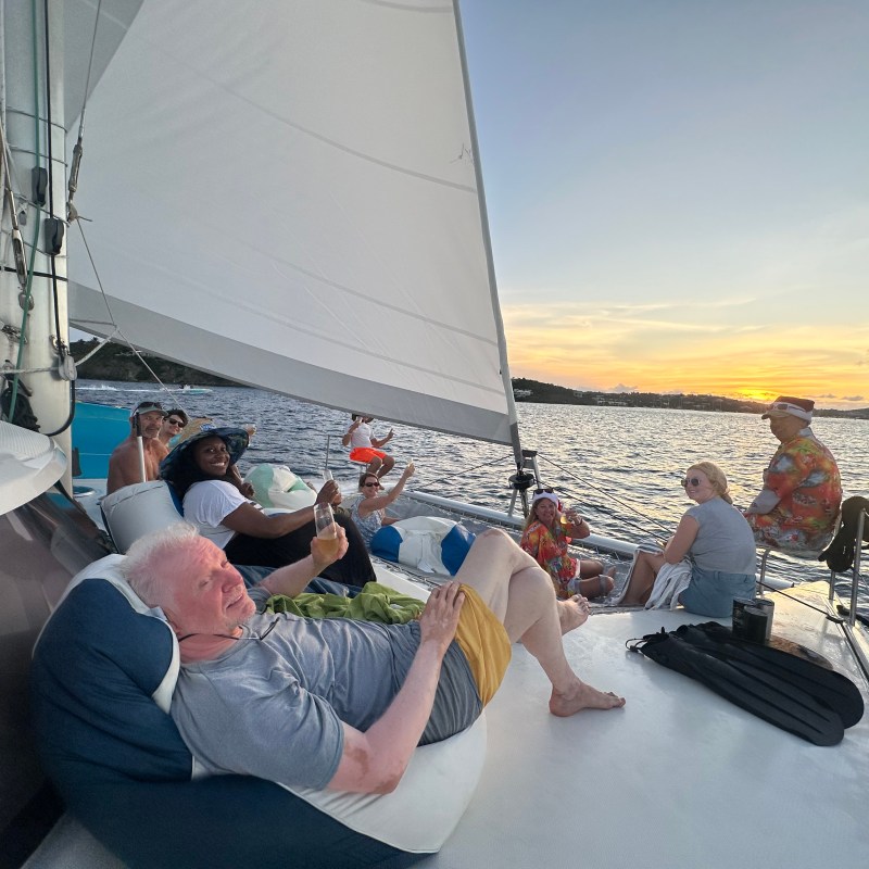 a group of people sitting on a boat
