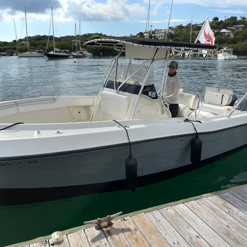 a boat is docked next to a body of water
