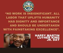 Quote on a red background with an image of Martin Luther King Jr. and text 'Happy Martin Luther King Jr. Day'.